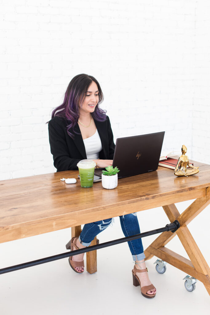 Woman sitting at a desk on laptop